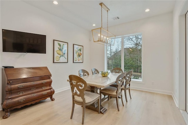 dining space with recessed lighting, light wood-type flooring, visible vents, and baseboards