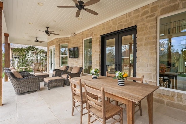 view of patio / terrace featuring a ceiling fan, outdoor dining space, french doors, and outdoor lounge area