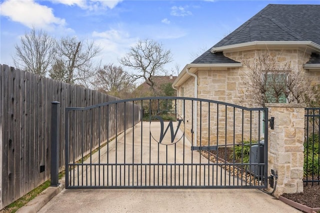 view of gate with fence