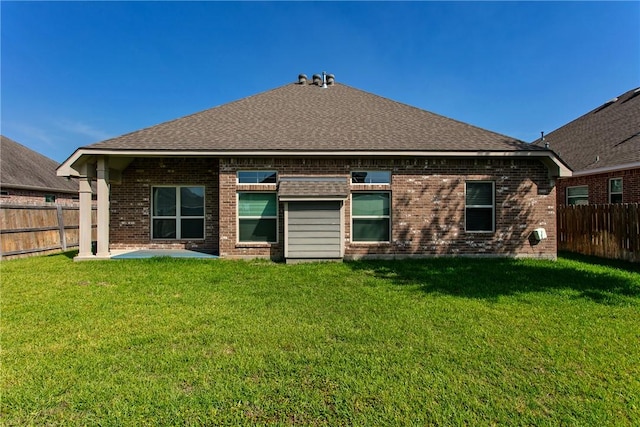 2515 Warkworth Ln, College Station, TX 77845 - back of house featuring brick siding, a patio, and a shingled roof