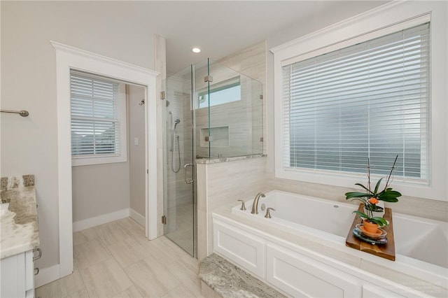 full bathroom featuring a garden tub, recessed lighting, baseboards, and a stall shower