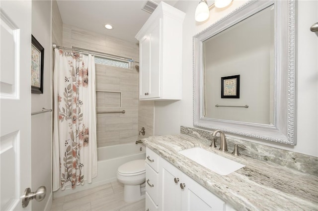 full bath featuring tile patterned flooring, vanity, toilet, shower / bath combo with shower curtain, and recessed lighting