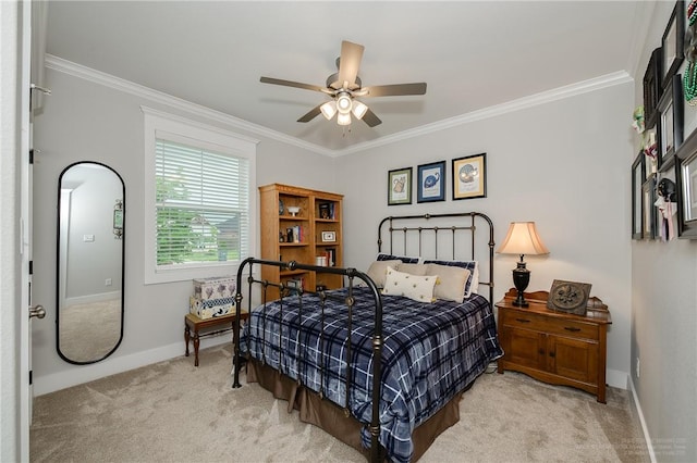 carpeted bedroom featuring baseboards, ornamental molding, and ceiling fan