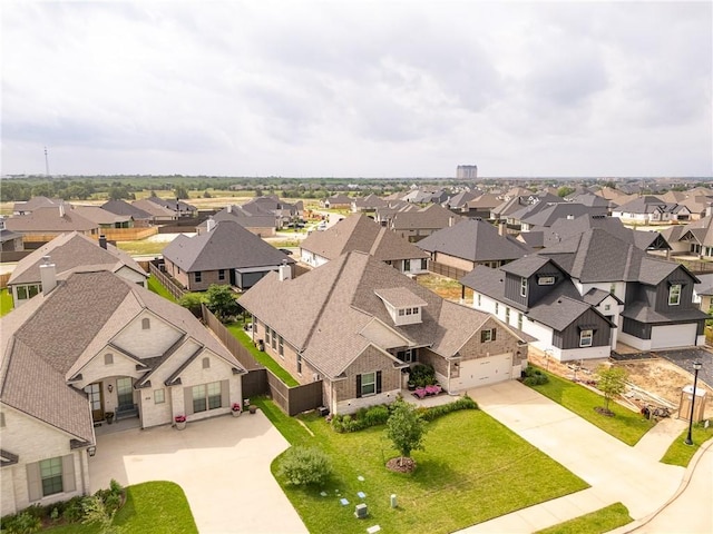 birds eye view of property with a residential view