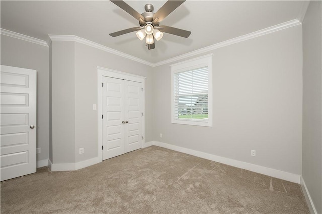 5012 Grayson Way, Bryan, TX 77802 - unfurnished bedroom featuring crown molding, carpet, ceiling fan, and a closet