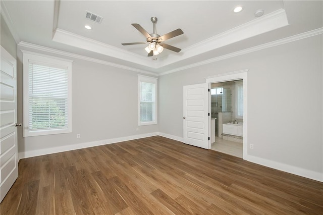 5012 Grayson Way, Bryan, TX 77802 - empty room with a raised ceiling, a ceiling fan, wood finished floors, a smoke detector, and ornamental molding