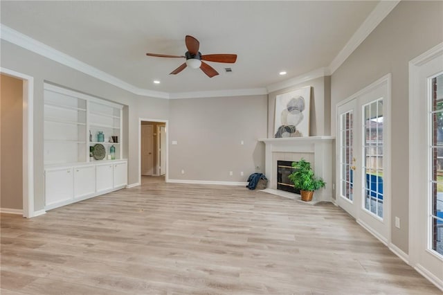 4213 Bedford Ct, Bryan, TX 77802 - unfurnished living room featuring crown molding, ceiling fan, light wood-type flooring, recessed lighting, and a tiled fireplace