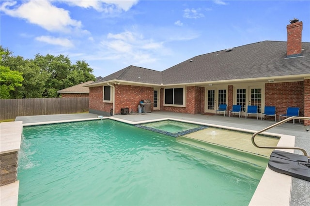 4213 Bedford Ct, Bryan, TX 77802 - view of pool with a patio area, french doors, grilling area, and a pool with connected hot tub