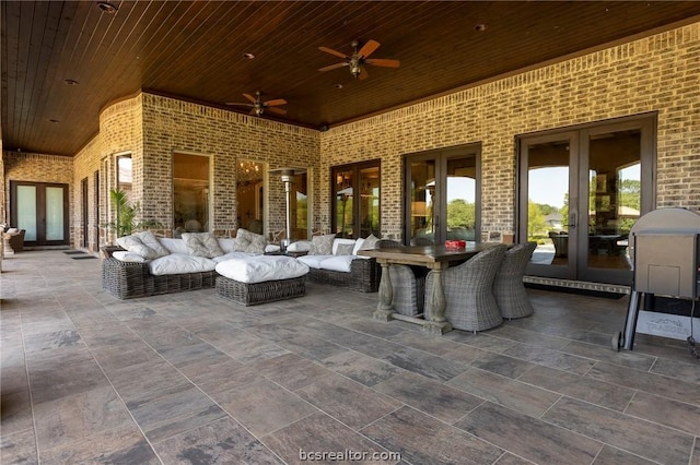 view of patio featuring ceiling fan and french doors