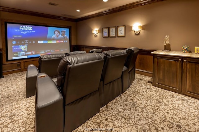 carpeted home theater with crown molding