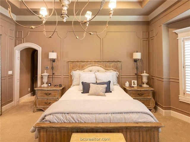 carpeted bedroom featuring a raised ceiling and crown molding