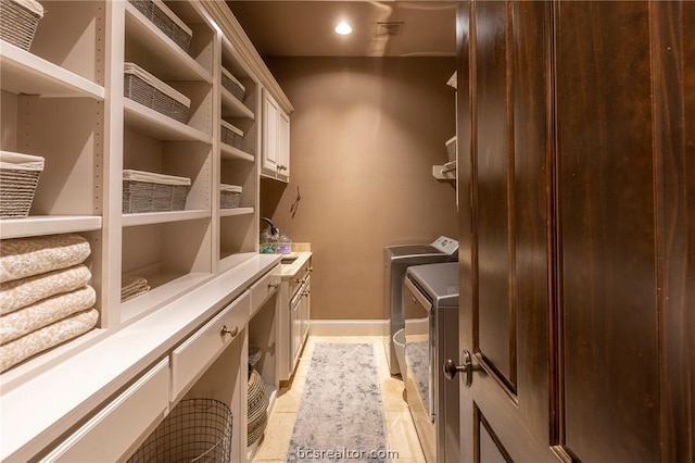 interior space featuring washer and clothes dryer and sink