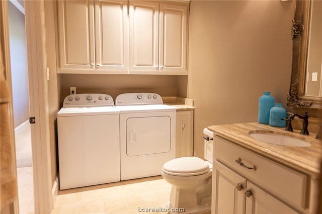 laundry area with independent washer and dryer and sink