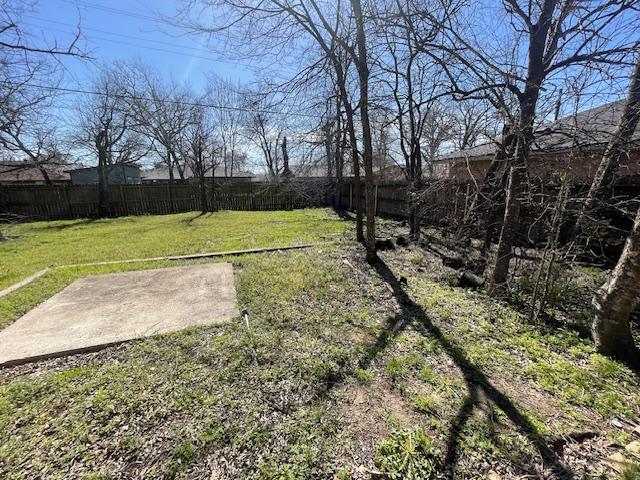 view of yard with a patio area and a fenced backyard