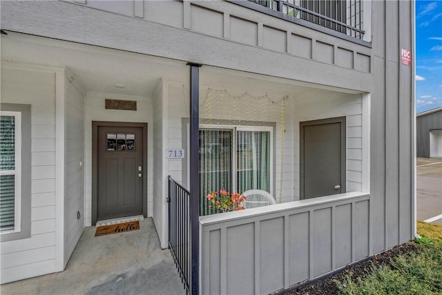 doorway to property with a porch