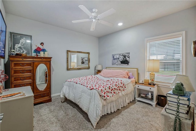 carpeted bedroom featuring ceiling fan, baseboards, and recessed lighting