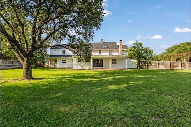 1712 Glade St, College Station, TX 77840 - rear view of house featuring a chimney