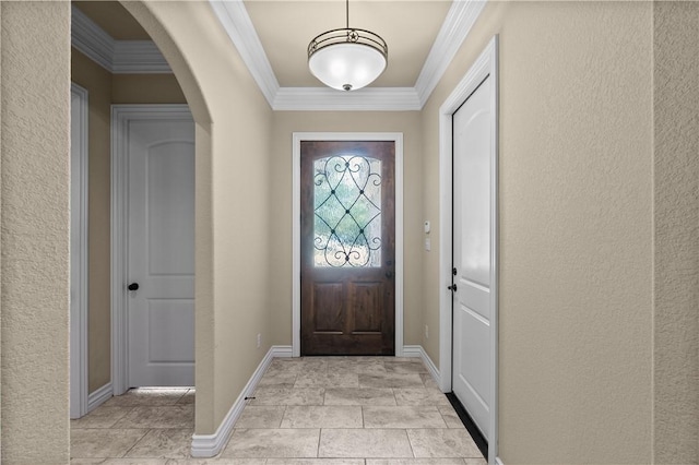 5104 Stonewater Loop, College Station, TX 77845 - foyer entrance featuring ornamental molding, arched walkways, and a textured wall