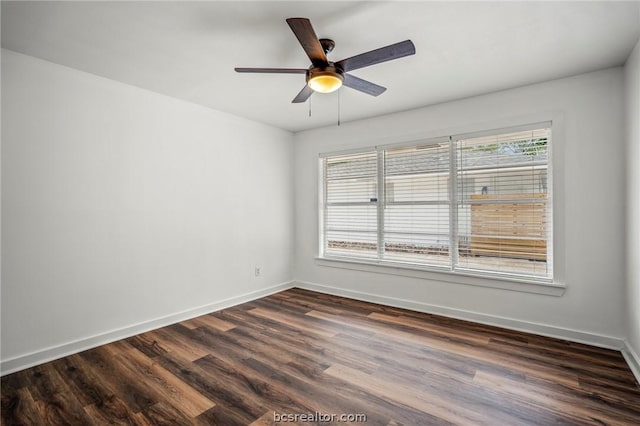 spare room with ceiling fan and dark wood-type flooring