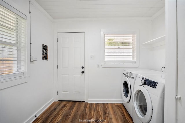 washroom featuring dark hardwood / wood-style flooring, separate washer and dryer, and ornamental molding