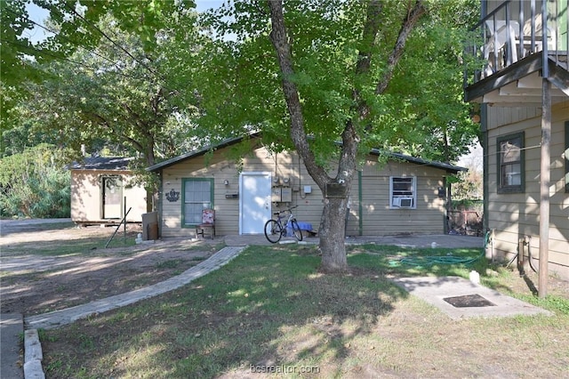 view of front of house featuring a storage shed