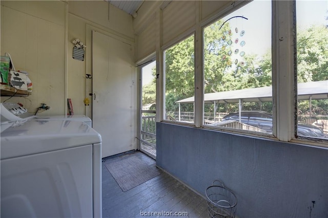 803 Holland St, Navasota, TX 77868 - washroom featuring hardwood / wood-style flooring, wood walls, and washer / dryer