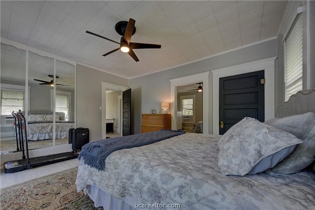 803 Holland St, Navasota, TX 77868 - bedroom with hardwood / wood-style flooring, ceiling fan, and ornamental molding