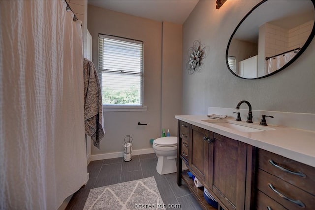 803 Holland St, Navasota, TX 77868 - bathroom featuring tile patterned floors, vanity, and toilet