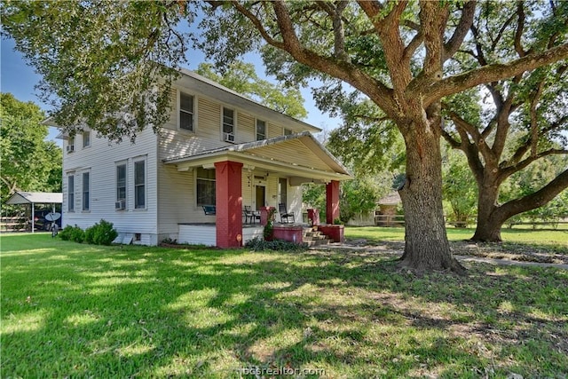 view of front of home with covered porch and a front yard