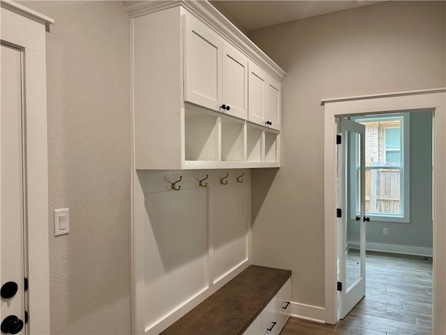 mudroom with dark hardwood / wood-style floors