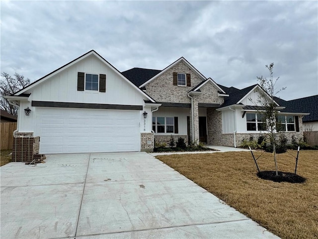 view of front of house with a garage and a front yard