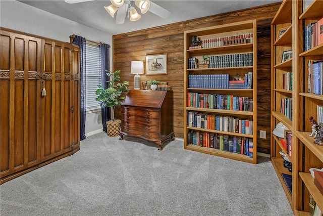 interior space with ceiling fan