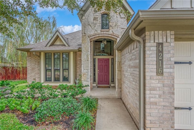 doorway to property with a garage