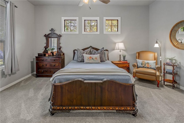 bedroom featuring light colored carpet and ceiling fan