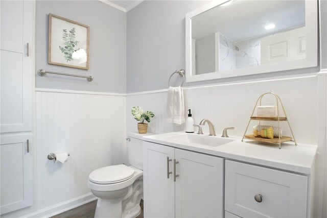 407 N Amthor St, Bellville, TX 77418 - bathroom featuring vanity, toilet, and hardwood / wood-style floors