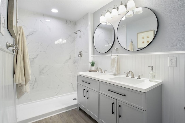 407 N Amthor St, Bellville, TX 77418 - bathroom with hardwood / wood-style flooring, vanity, and tiled shower