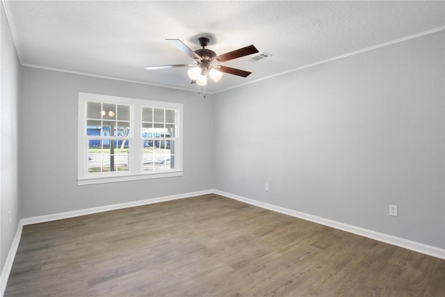 407 N Amthor St, Bellville, TX 77418 - unfurnished room featuring crown molding, ceiling fan, dark hardwood / wood-style flooring, and a textured ceiling