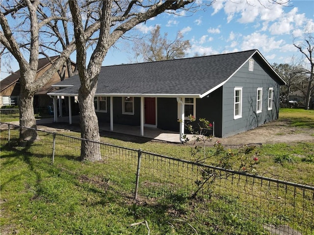 407 N Amthor St, Bellville, TX 77418 - back of house featuring a lawn and a patio area