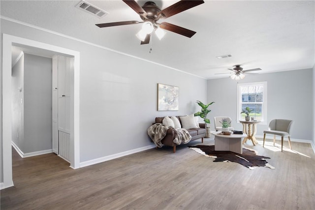 407 N Amthor St, Bellville, TX 77418 - living room featuring ornamental molding, dark hardwood / wood-style floors, a textured ceiling, and ceiling fan