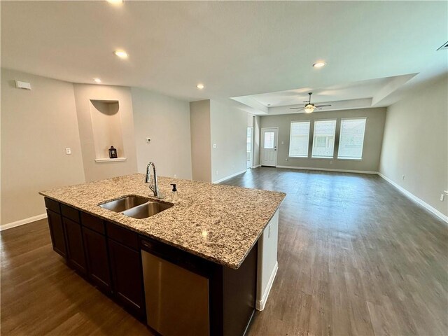 4704 Los Pines Way, Bryan, TX 77807 - kitchen featuring a sink, dark wood-type flooring, stainless steel dishwasher, a center island with sink, and recessed lighting