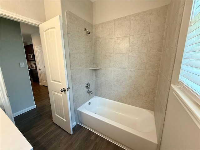 4704 Los Pines Way, Bryan, TX 77807 - bathroom featuring wood finished floors,  shower combination, and baseboards