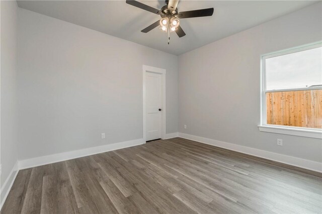 unfurnished room with hardwood / wood-style flooring and ceiling fan