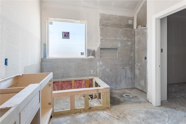 bathroom featuring concrete floors