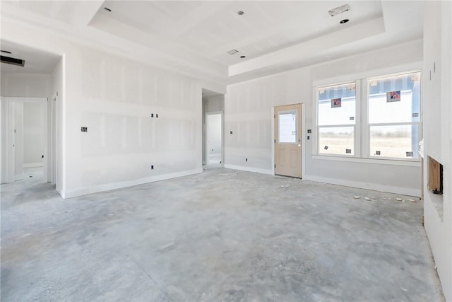 spare room with a tray ceiling