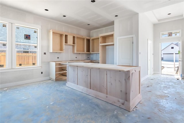 kitchen with a healthy amount of sunlight and light brown cabinetry