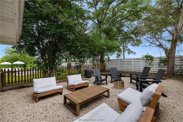 view of patio / terrace featuring an outdoor living space with a fire pit