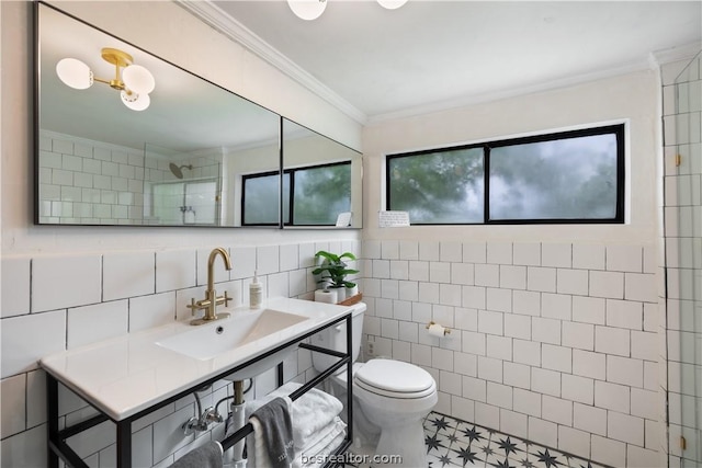 bathroom featuring sink, tile patterned flooring, a shower, crown molding, and tile walls