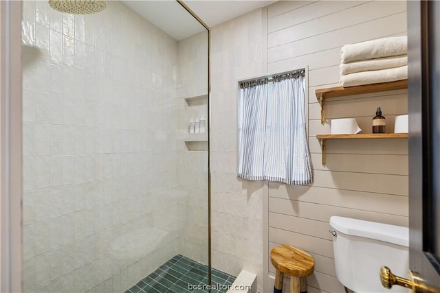 bathroom with tiled shower and toilet