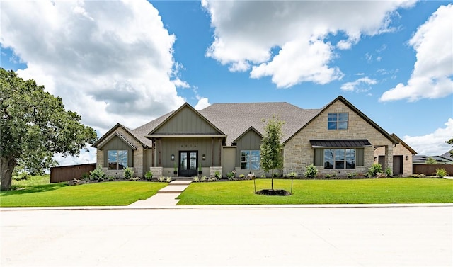 view of front facade with french doors and a front yard