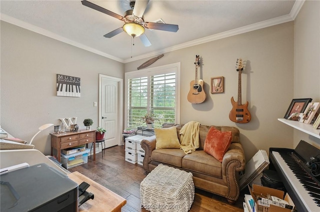 living room featuring ornamental molding, ceiling fan, and dark wood-type flooring